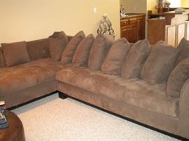 Quality L shaped sectional with matching ottoman. Also Leather round ottoman.