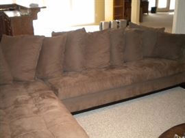 Quality L shaped sectional with matching ottoman. Also Leather round ottoman.