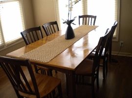 Sharp kitchen table and 6 chairs. Solid wood two tone with one leaf.