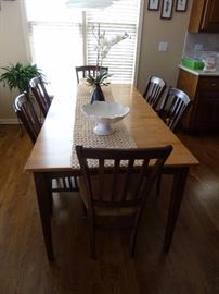 Sharp kitchen table and 6 chairs. Solid wood two tone with one leaf.