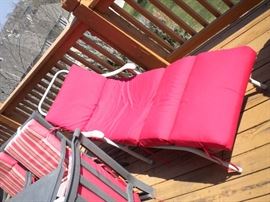 Patio set with 6 chairs, red cushions, seperate umbrella and stand, 4 chaise outdoor lounge chairs with red cushions.