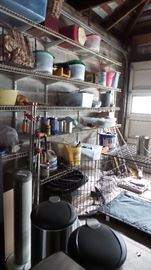 Garage full of lawn and garden and household products.  2 extra large dog kennels, storage containers