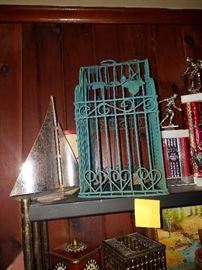 Cute little bird cage and a sail boat