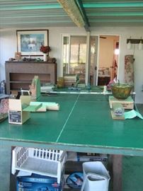 Ping pong table filling up with treasures including Indiana saw tooth punch bowl with 12 cups.