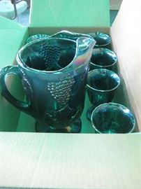 Indiana carnival glass footed grape harvest pitcher and 8 glasses.