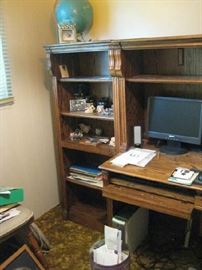 Shelving unit with computer desk.