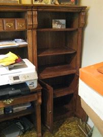 Shelving unit with computer desk.