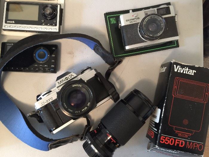 Minolta camera with accessories and Olympus camera