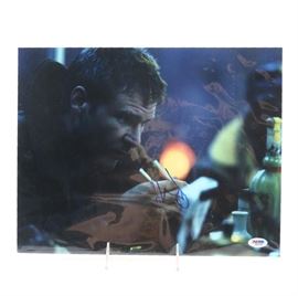Harrison Ford Signed "Blade Runner" Poster: A signed poster of Harrison Ford. This poster print, a scene of Ford in the 1982 movie Blade Runner, is signed near the center. The print is presented wrapped in plastic and includes a PSA/DNA label and certificate with the number A41435.