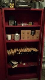 cabinet full of goodies... piano player rolls, hand-made soy candles, etc.