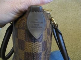 LV label on outside of purse