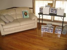 Leather settee and 10 boxes of 24 ct Oriental dish sets