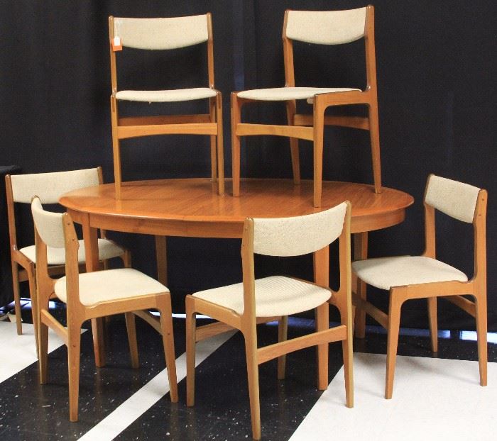 Lot 3067: Modern Danish Teak Dining Table with (6) Chairs; Height of chairs- 31 1/4"; height of table- 28 1/2"; View full catalog at www.slawinski.com