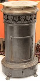 Lot 3126: French Cast Metal and Iron Stove, 19th Century, with marble top; View full catalog at www.slawinski.com