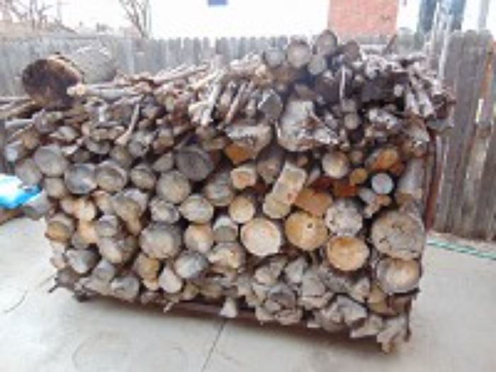 Load of firewood on a rolling iron cart
