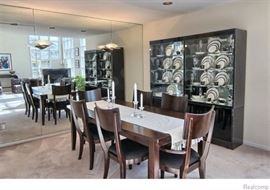 Dining Table with 6 chairs (4 side chairs & 2 captain chairs).  Table measures 82'' L (with leaf) x 40'' W x 29 1/2'' H with, leaf measures 20''.  Chair 20 1/2'' W x 20'' D x 38''H, seat height 17 1/2''.  Black Lacquered Light-up Glass Front Display Cabinet Curio by Ello Furniture.  36 1/4'' W x 17'' D x 75 1/4'' H