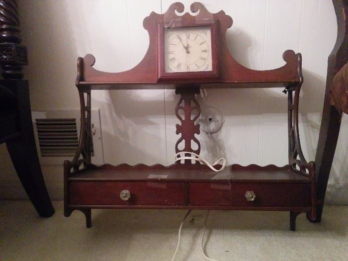 Mahogany hanging shelf, this one with clock insert and two drawers 