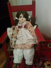 Doll and vintage chair for child