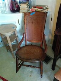 Punched wood seat and back on antique rocker