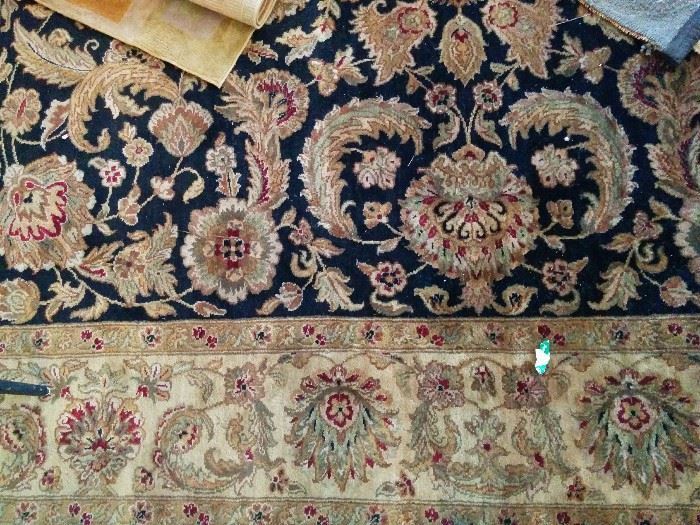 Border and part of center of one of the rugs