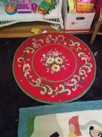 Another hooked rug, bright floral with red background