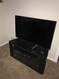 FLATSCREEN TV AND TV STAND