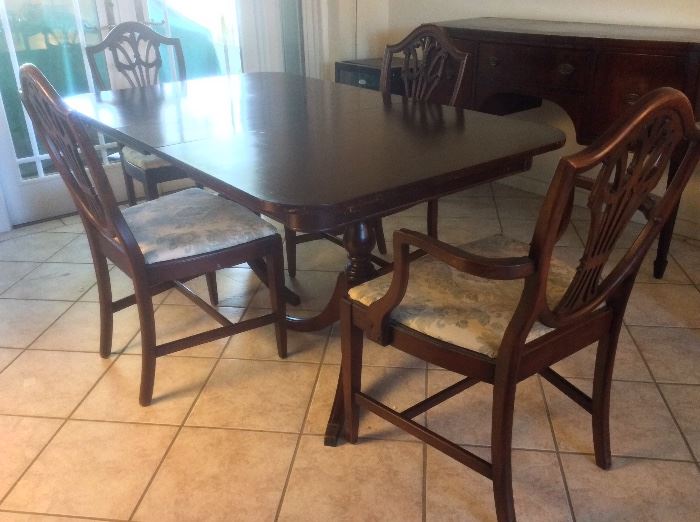 Duncan Phyfe Dining Room Table with four shield back chairs. 64" x 38" with 12" leaf in place. 