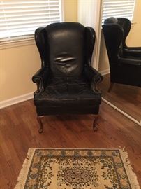 Black Leather upholstered chair.