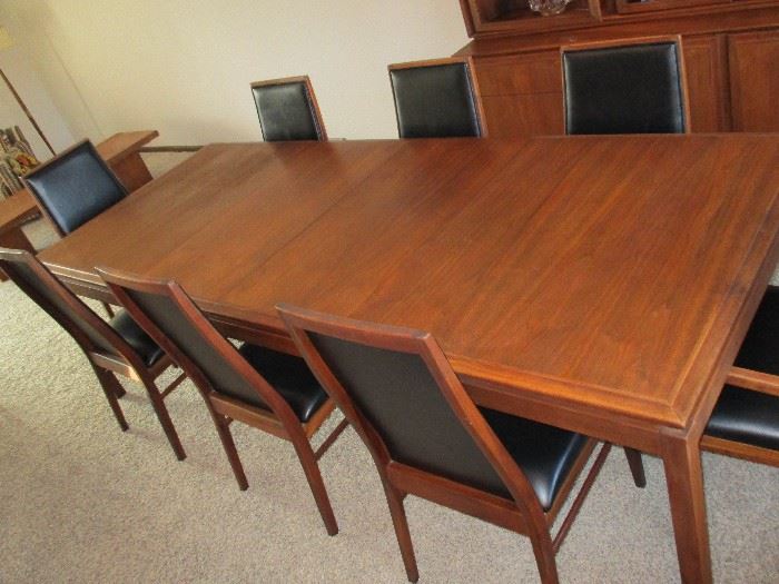 Rare vintage Dillingham black walnut dining set with 6 side chairs & 2 captains chairs.  Original upholstery.  Two leaves & table pads.  40" wide.  62" long with no leaves.  98" long with both leaves.