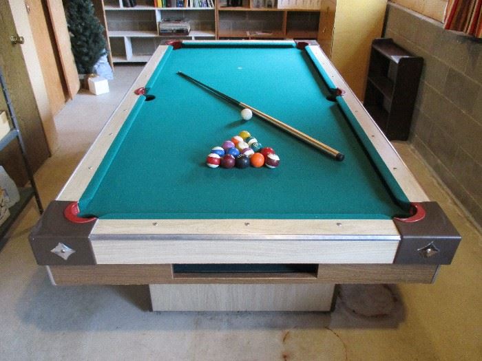 Retro pool table with wood top.  Very easy to move!  Comes with table tennis wood cover, net, paddles & more. 