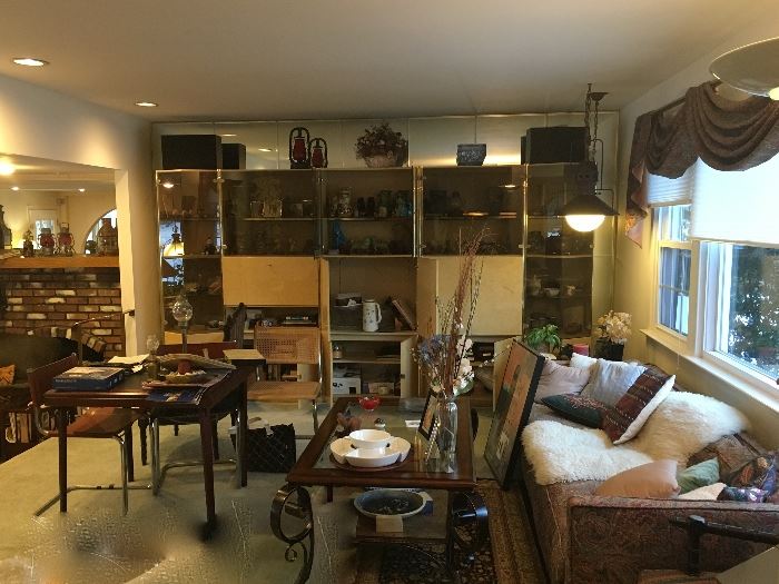 Large mirrored wall unit, sofas, coffee tables
