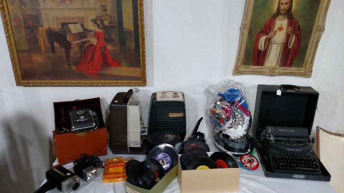 Movie Projectors, cameras, 45 records and typewriter 