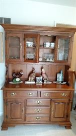 Hutch that has glass/wood shelves that is also lighted. 2 piece for easy moving 