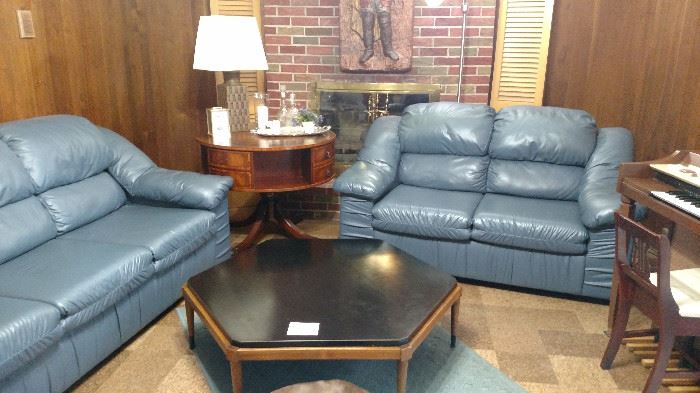  Blue faux leather sofa and loveseat. The next photo better represents the actual color. 1970's style sofa table.  There is 2 other tables that match this one.