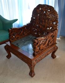 Ornate carved oriental chair with marble seat