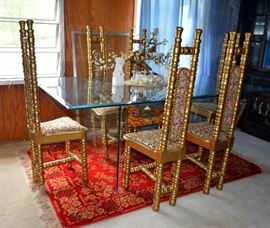 1960s beveled glass table with custom painting on the inset. 6 gold chairs that were custom made for Doc