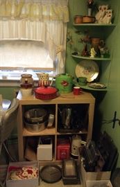 Crocks, German polka dot pitcher, colorful green biscuit jar, assorted baking pans, crocheted hot pads