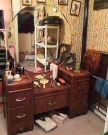Waterfall vanity with round mirror, vintage ring boxes, compacts, brush & mirror set, vintage standing frame, bath scale. Also vintage twin metal bed with headboard & footboard. 