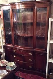 Bassett mahogany china cabinet with curved glass