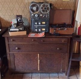 Old oak buffet, Delineascope slide projector with Arequipt automatic slide changer, Roberts 770 4-track tape recorder (reel to reel), Crosley CR49 record player.