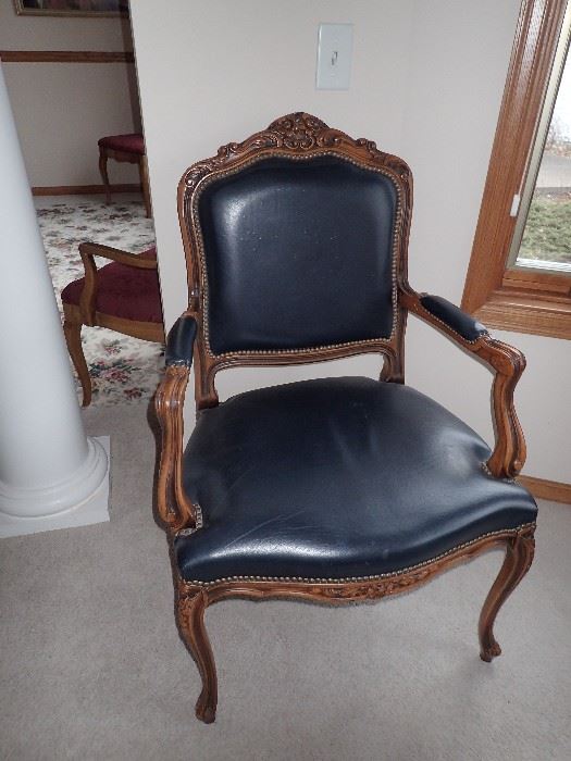 NAVY LEATHER SIDE CHAIR WITH CARVED WOOD DETAIL