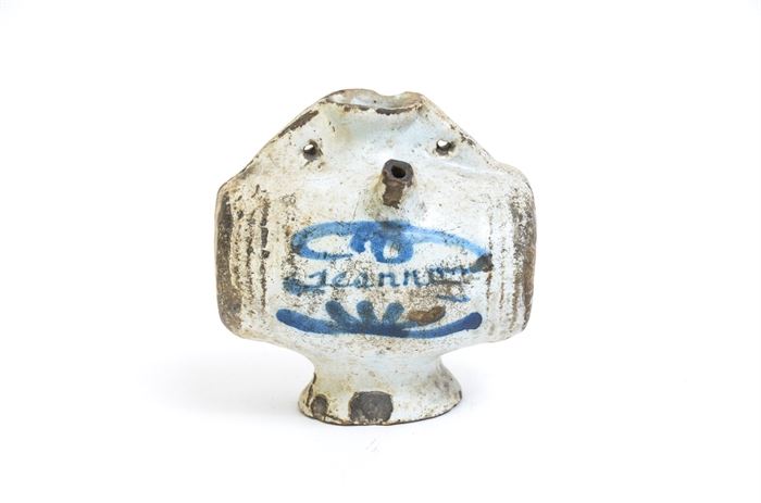 Antique Stoneware Water Jug: An antique stoneware water vessel. The salt glazed jug as a blue medallion on the center. On the top of the jug are two spouts, which allow water to flow out of the drinking end when turned up.
