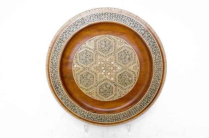 Persian Khatam Mother of Pearl and Bone Inlaid Wooden Plate: A Persian Khatam plate. This plate features an inlaid mother of pearl and bone mosaic design in wood, with hanging ring to back.
