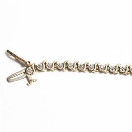 10K Yellow Gold and 0.25 ctw Diamond Bracelet: A 14K yellow gold and 0.25 ctw diamond bracelet.
