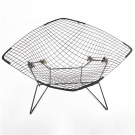Original Harry Bertoia for Knoll International Large Diamond Chair With Cover: An original mid-century modern 422LU Bertoia Diamond chair for Knoll International with vinyl covered black wire rod seat and frame. This iconic mid-century modern design by sculptor Harry Bertoia is a fascinating study of line, form, function, and space. Chair has original full cover in woven mustard and black.