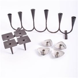 Vintage Dansk and Lundtofte Candleholders: A group of mid-century Danish candleholders. Selection includes four triangular Lundehofte Denmark stainless steel petite taper holders, a Dansk Designs of Denmark wrought iron mini-taper candle holder with four joined squares on tapered legs, marked to base; and a wrought iron six pillar candleholder that is stamped Made in Sweden X 603 to the feet.