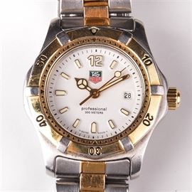 Women's Tag Heuer Wristwatch: A women’s Tag Heuer wristwatch with a two-tone band.