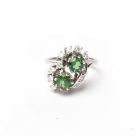 18K White Gold Green Tourmaline and Diamond Ring: An 18K white gold green tourmaline and diamond ring.
