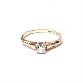 14K Yellow and White Gold Diamond Ring: A 14K yellow and white gold diamond ring. This ring features a transitional round cut diamond in a 14K yellow and white gold shank. The total approximate diamond karat weight is 1.00 ctw.