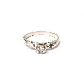 14K White Gold Diamond Ring: A 14K white gold diamond ring.
